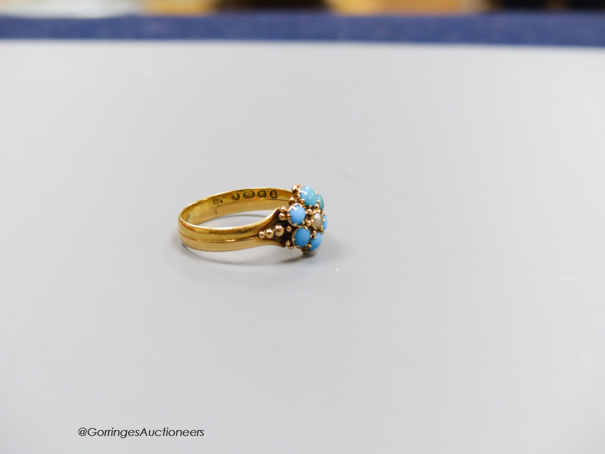 A Victorian 22ct gold, turquoise and pearl ring, size O, gross 3.3g.